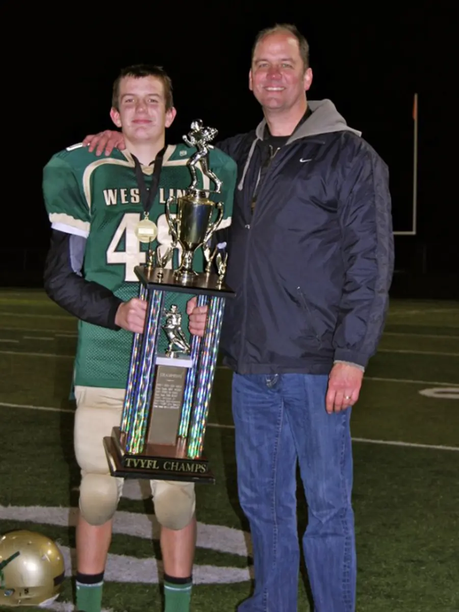 Steve forsyth with his son Alex after winning a football game | steve forsyth memorial fund